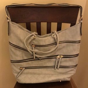 Large purse with decorative zippers